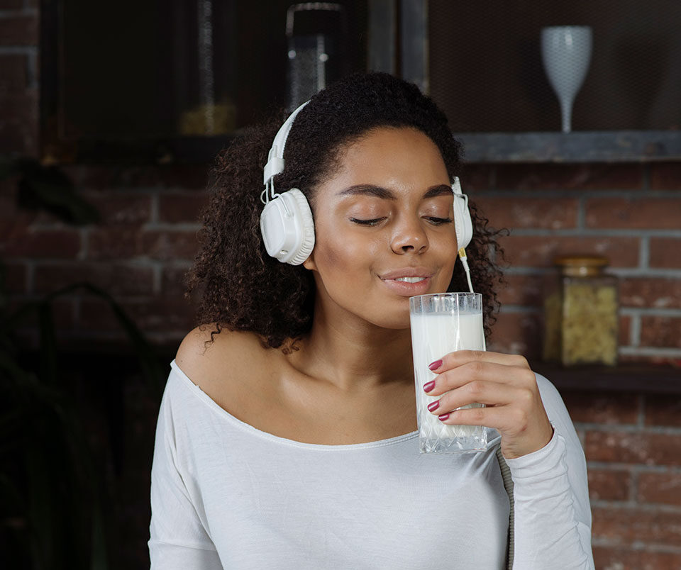 A woman smelling the aroma of royal milk